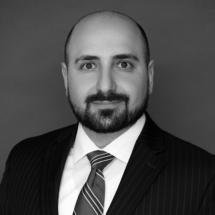 Headshot of Arsen Kourinian, greyscale